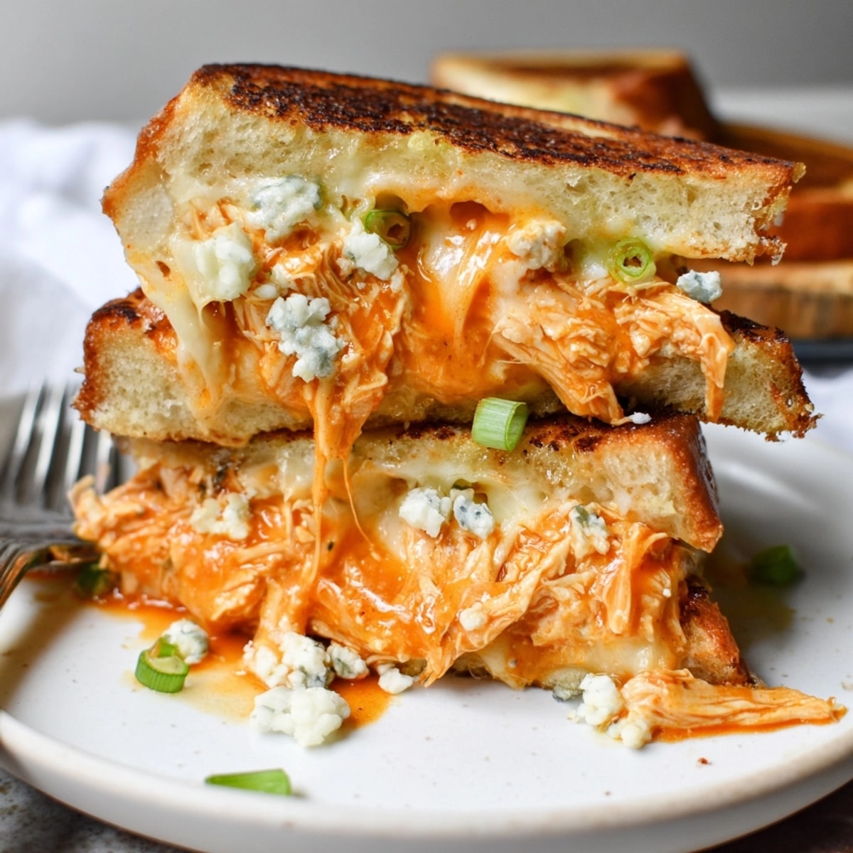 Golden Buffalo Chicken Grilled Cheese oozing cheddar, a lunchtime explosion of flavor.