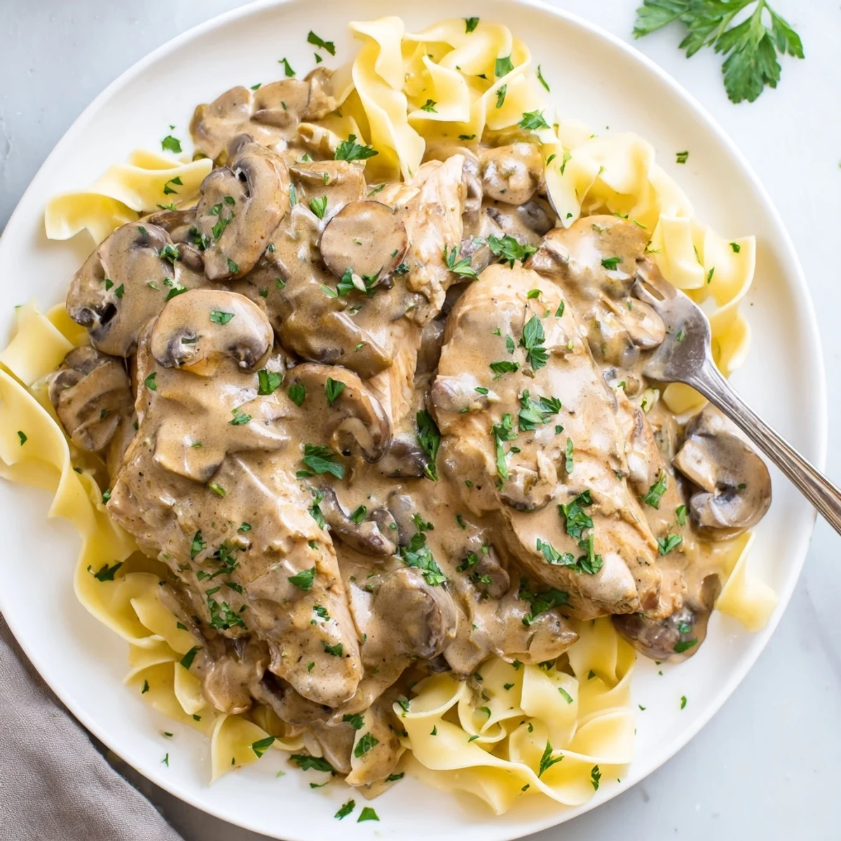 Savor the comforting flavors of Creamy Chicken Stroganoff, perfect for cozy dinners.