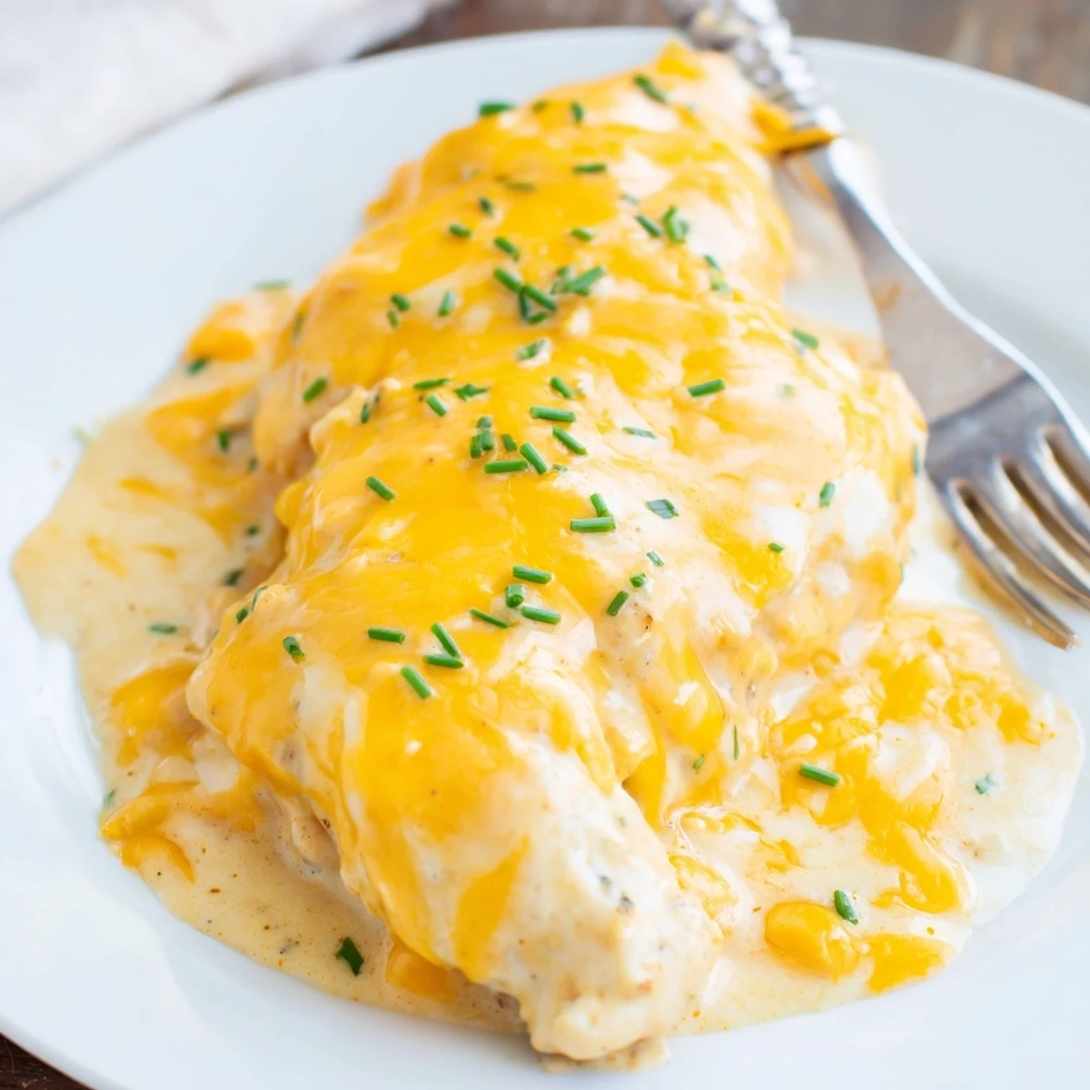 Juicy Cheddar Ranch Chicken Bake topped with golden, bubbly cheese and herbs.  