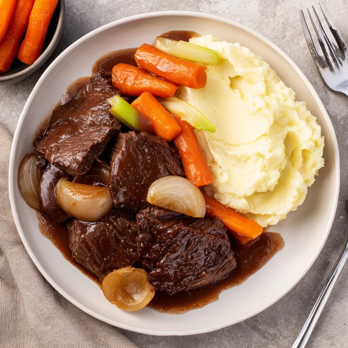 Tender slow cooker pot roast with carrots and potatoes, a comforting American classic.