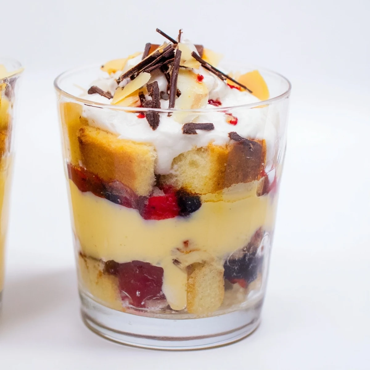 Holiday-ready Simplified Christmas Trifle Cups with vibrant fruit, chilled custard, and fluffy whipped cream.