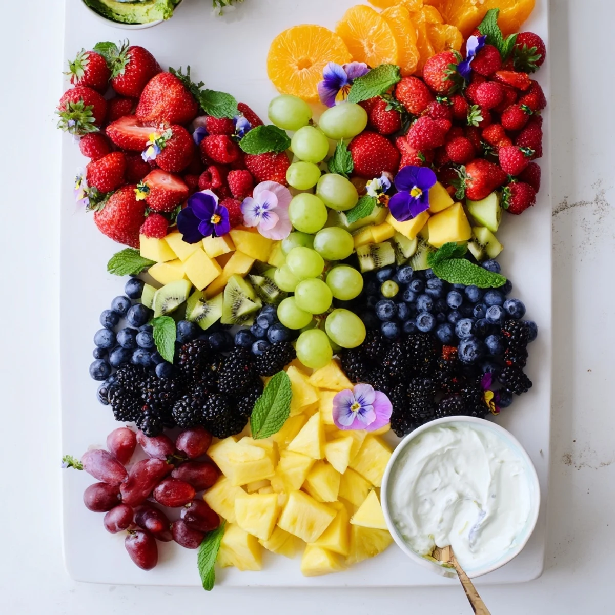 This Butterfly Garden Fruit Board shows a stunning, edible art display of vibrant, sweet berries, perfect for kids.