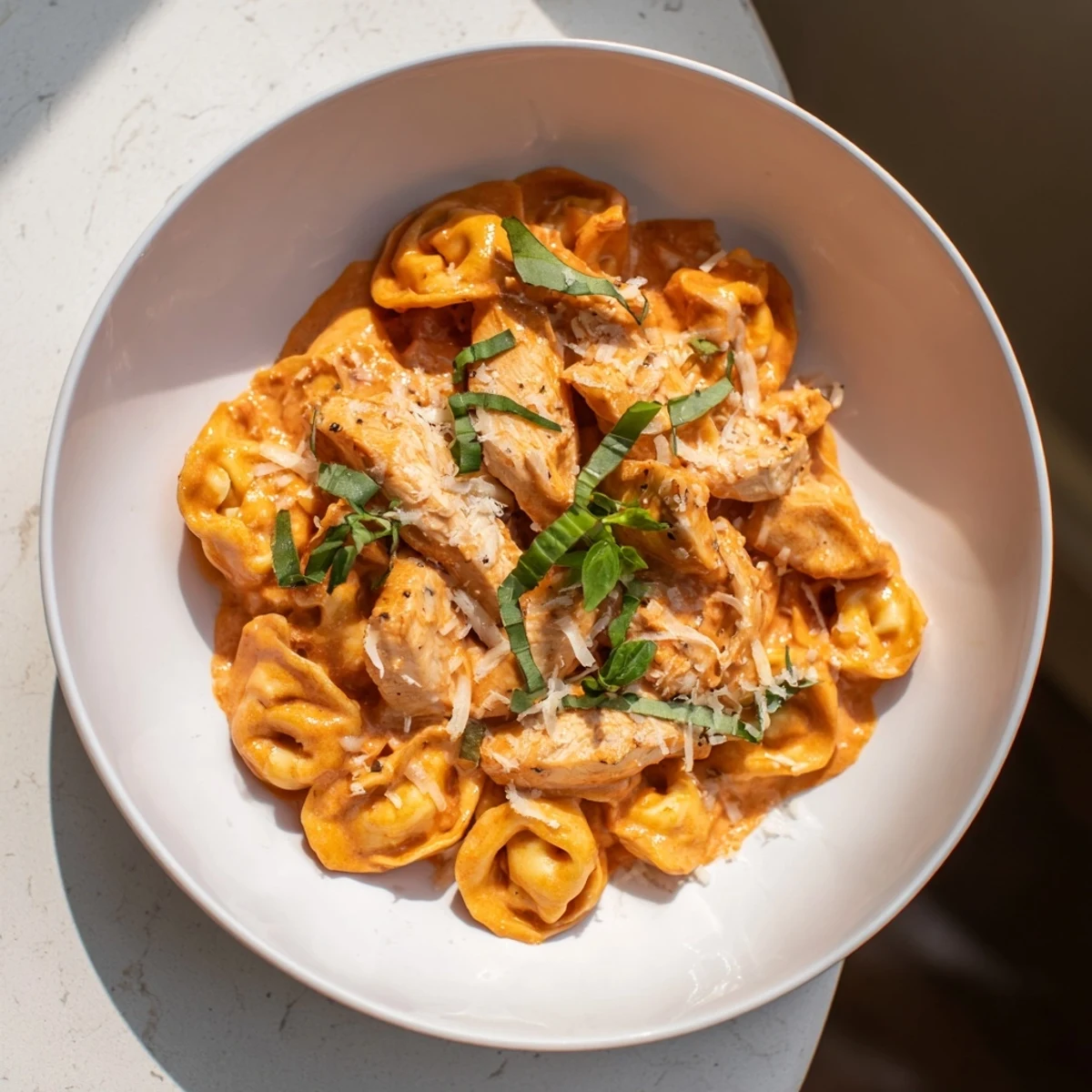 Creamy Marry Me Chicken Tortellini with tender pasta and juicy chicken pieces, ready to serve.
