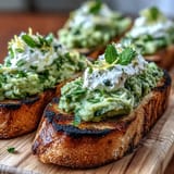 Bright spring bruschetta: fava beans, mint, and lemon zest on grilled bread.