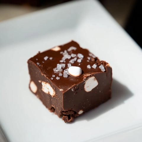 Creamy, decadent Easy Marshmallow Fudge, swirled with vanilla and packed with soft mini marshmallows.