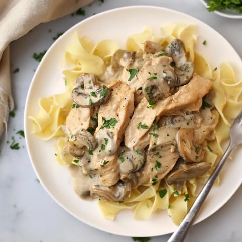 Deliciously rich Creamy Chicken Stroganoff with savory mushrooms and tender chicken pieces.  