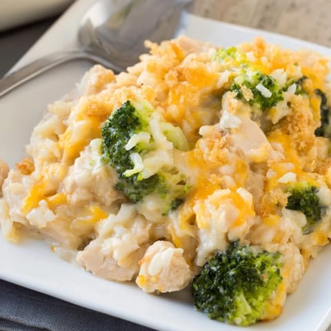 A hearty helping of steaming Chicken & Broccoli Rice Casserole, featuring tender chicken and rice.