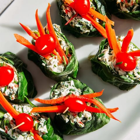 Freshly rolled Holly Leaf Spinach Wraps present with colorful vegetables for easy eating.