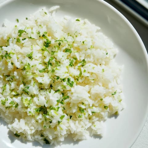 Steaming bowl of Cilantro Lime Rice, ready to serve with your favorite Mexican dishes tonight.