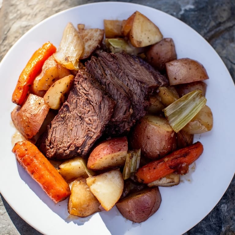 A close-up shot of the incredibly flavorful Sunday Pot Roast, showcasing soft, slow-cooked beef and veggies.