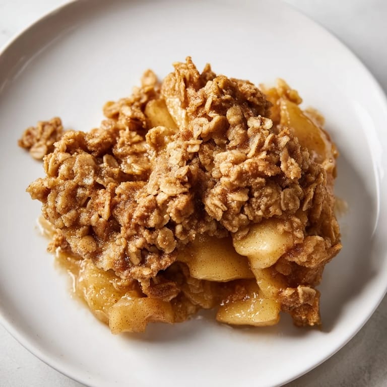 Freshly baked Apple Crisp with frozen apples provides a sweet, comforting, classic American taste.