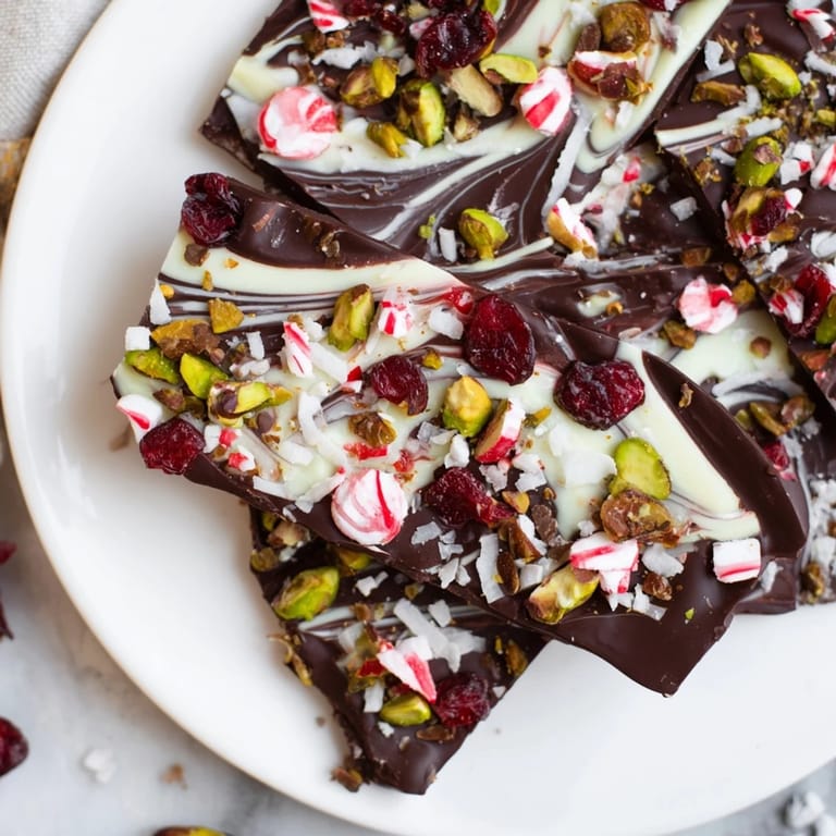 Showcasing the delicious Holiday Bark: Irregular, chocolate shards sprinkled with festive reds and greens.