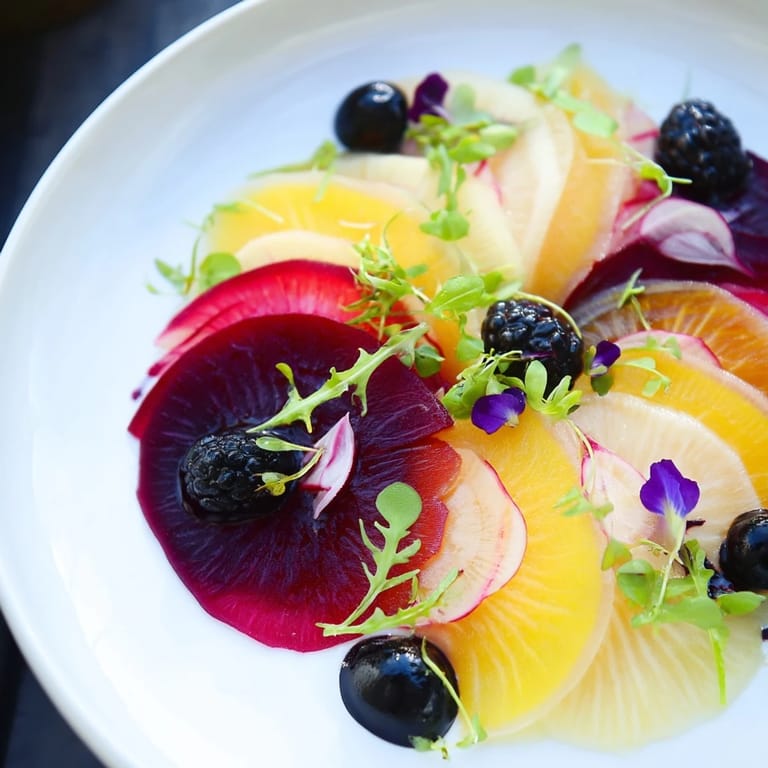 Enjoy The Shadow Play salad with a drizzle of dressing, anticipating the beautiful dark and bright flavors.