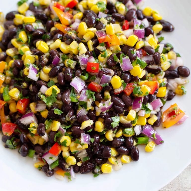 Close-up shot shows a delightful bowl of Cowboy Caviar Salad bursting with fresh flavors.