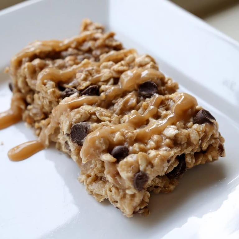 Stacked Peanut Butter Banana Oat Bars, offering a satisfying wholesome treat, bursting with peanut butter flavor.