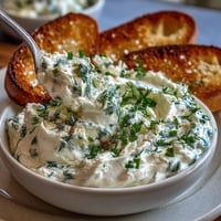 Creamy whipped cottage cheese ranch dip with fresh herbs and crisp vegetable sticks. A protein-rich, gluten-free appetizer for healthy snacking.